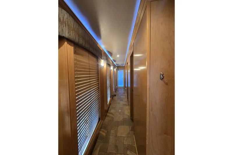 Slide: The Image of Luxurious Thoroughbred 80'x 18' 2013 model interior hallway with wood paneling and ambient lighting. - 32