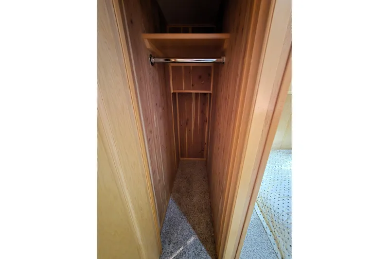 Slide: The Image of Wooden closet interior with shelf and hanging rod in 2013 Thoroughbred model. - 46