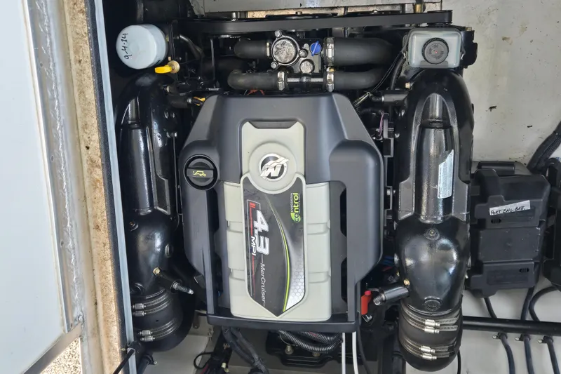 Slide: The Image of Engine compartment of a 2013 Thoroughbred 80'x 18' boat, featuring a 4.3 MPI MerCruiser. - 53