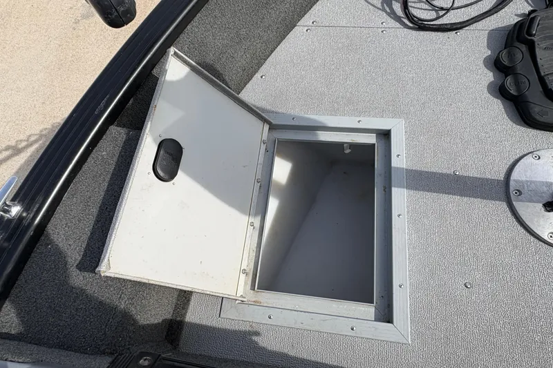 Slide: The Image of Open storage compartment on 2017 Starcraft Renegade 168 DC boat deck. - 12