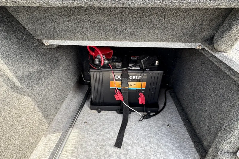 Slide: The Image of Battery compartment of 2017 Starcraft Renegade 168 DC boat, featuring a Duracell marine battery. - 17