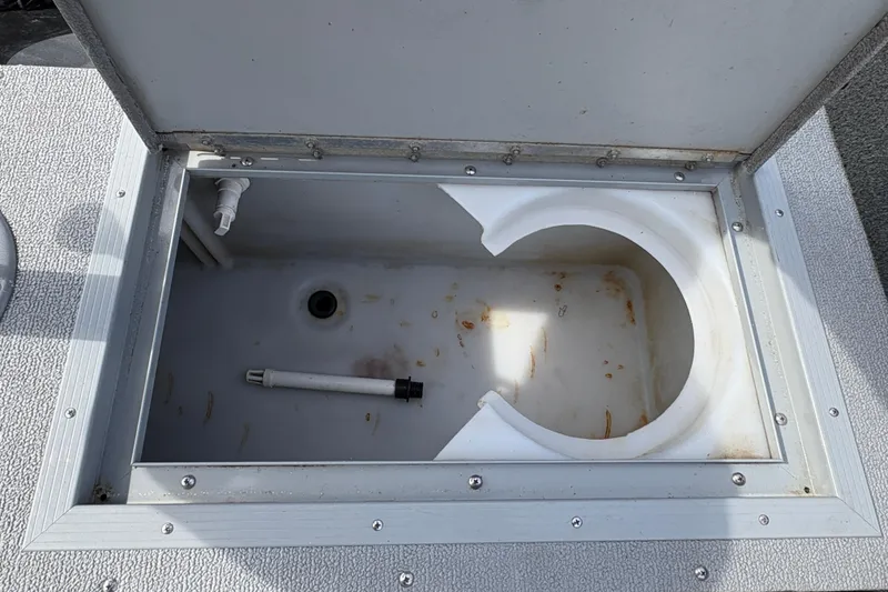 Slide: The Image of Open storage compartment in 2017 Starcraft Renegade 168 DC boat. - 23