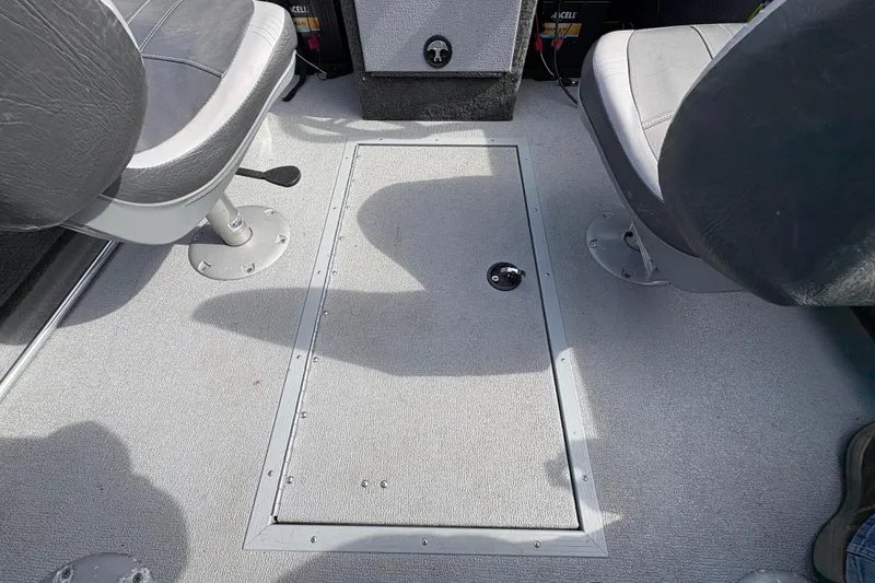 Slide: The Image of Interior of 2017 Starcraft Renegade 168 DC boat showing seating and storage compartment. - 27