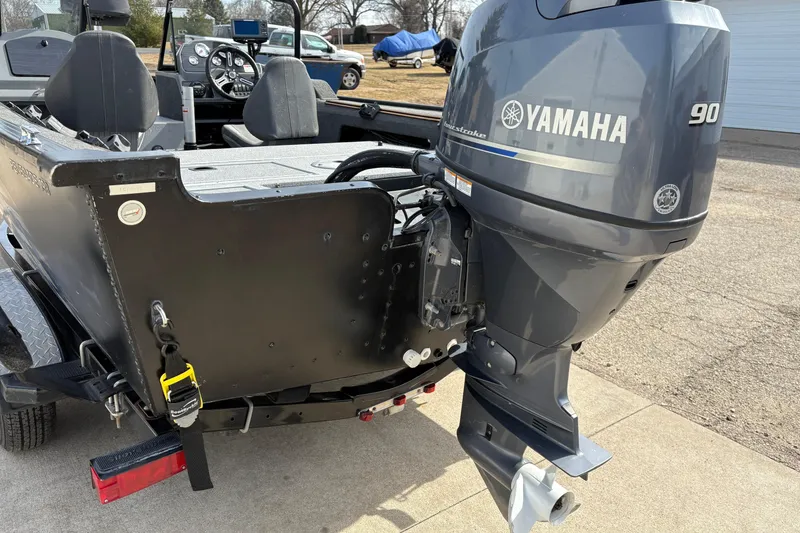 Slide: The Image of 2017 Starcraft Renegade 168 DC boat with Yamaha 90 outboard motor, parked outdoors. - 3