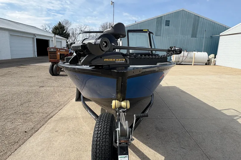 Slide: The Image of 2017 Starcraft Renegade 168 DC boat on trailer, featuring Minn Kota trolling motor. - 7