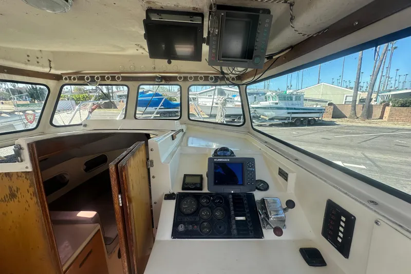 Slide: The Image of 1992 Farallon Whaleback boat interior with navigation equipment and control panel. - 5