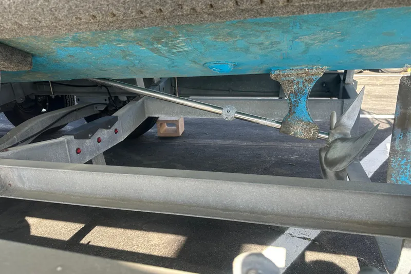 Slide: The Image of 1992 Farallon Whaleback boat propeller and shaft on trailer, showing wear and blue paint. - 8