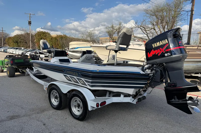 Slide: The Image of 1999 Charger 195TF boat with Yamaha VMAX outboard motor on a trailer. - 11