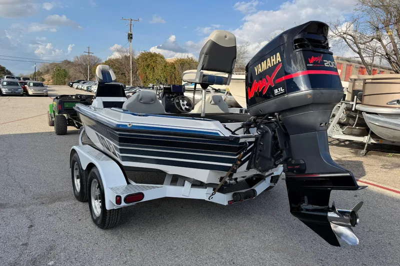 Slide: The Image of 1999 Charger 195TF boat with Yamaha VMAX 200 outboard motor on trailer. - 12