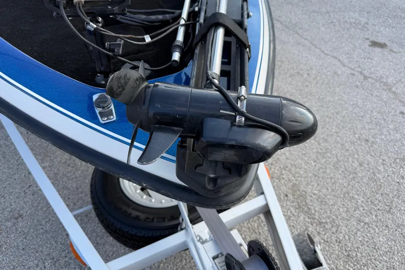 Slide: The Image of Boat motor on a 1999 Charger 195TF, mounted on a trailer. - 32