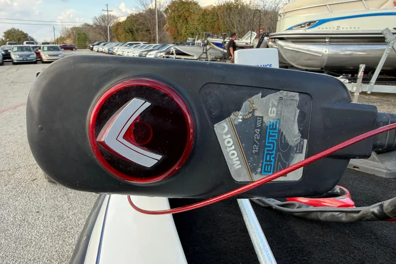 Slide: The Image of Outdoor view of a Charger 195TF motor, model year 1999, with a Brute 67 label. - 33