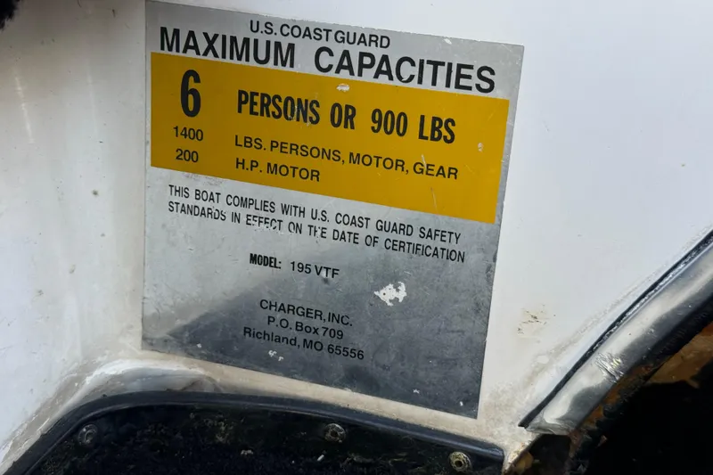Slide: The Image of 1999 Charger 195TF boat capacity label, 6 persons or 900 lbs, U.S. Coast Guard compliant. - 47