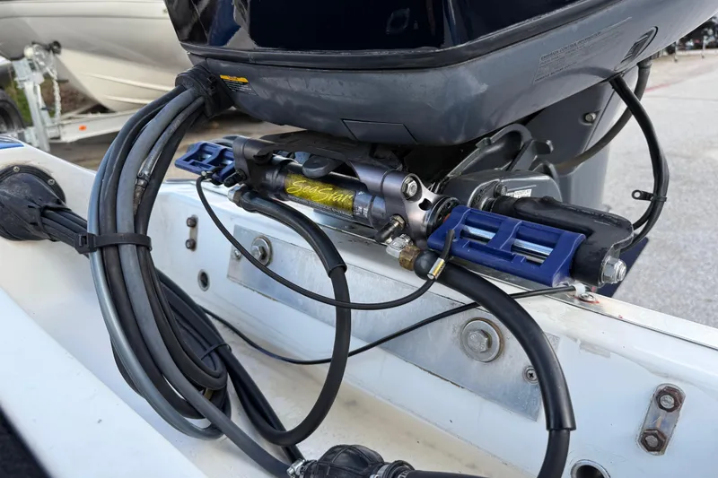 Slide: The Image of Hydraulic steering system on a 1999 Charger 195TF boat, featuring SeaStar components. - 55