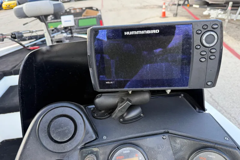 Slide: The Image of Humminbird Helix 7 fish finder on 1999 Charger 195TF boat dashboard. - 56