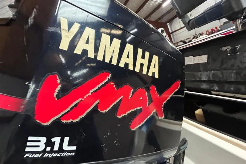 Slide: The Image of 1999 Charger 195TF boat on trailer, featuring Yamaha VMAX outboard motor. - 8
