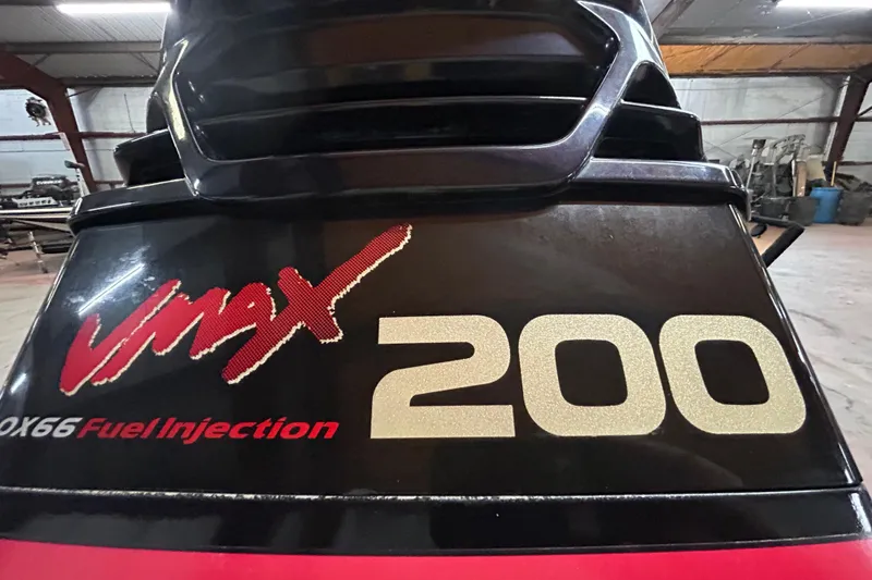 Slide: The Image of 1999 Charger 195TF boat on trailer, featuring Yamaha VMAX outboard motor. - 9