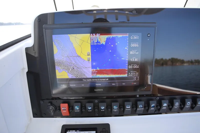 Slide: The Image of Garmin navigation display on 2020 Sea Hunt Ultra 255 SE boat dashboard. - 14