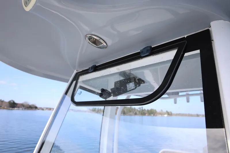 Slide: The Image of 2020 Sea Hunt Ultra 255 SE boat window detail with scenic water view. - 22