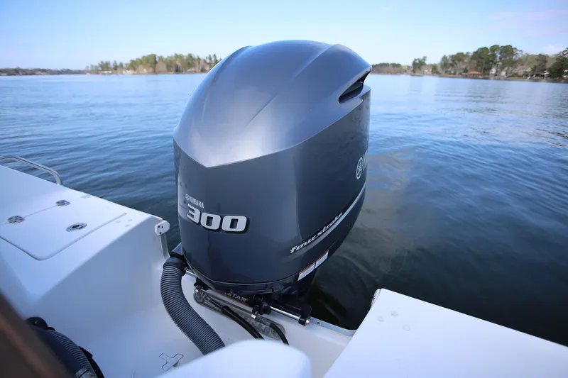 Slide: The Image of 2020 Sea Hunt Ultra 255 SE with Yamaha 300 outboard engine on calm water. - 29