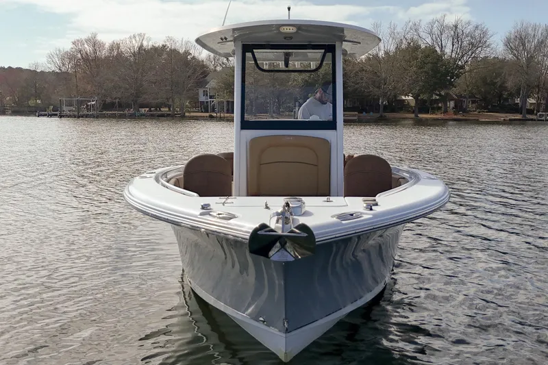 Slide: The Image of 2020 Sea Hunt Ultra 255 SE boat on calm water, front view. - 3