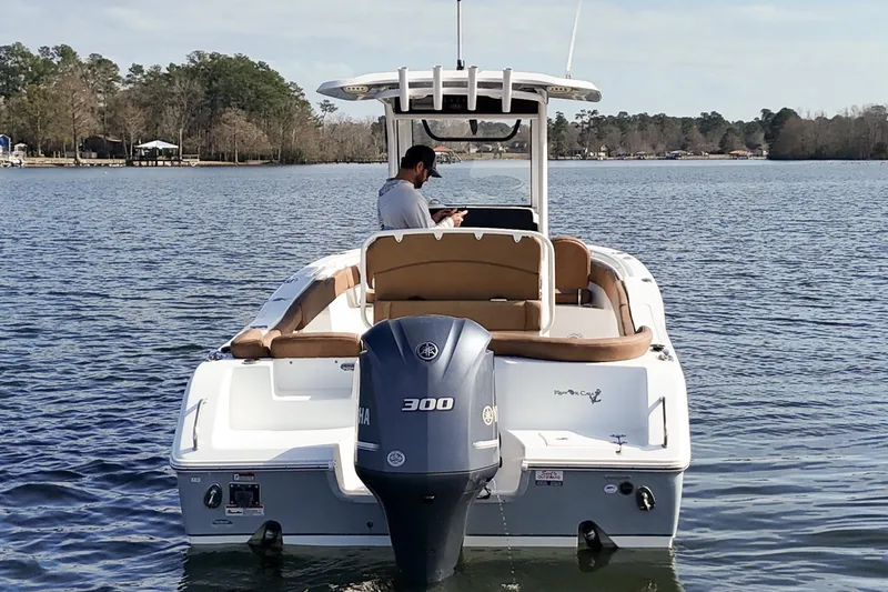 Slide: The Image of 2020 Sea Hunt Ultra 255 SE boat on a calm lake with a Yamaha 300 engine. - 6