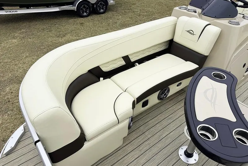 Slide: The Image of Luxurious seating on 2026 SunCatcher Fusion 324SL boat, featuring elegant design and cup holders. - 12