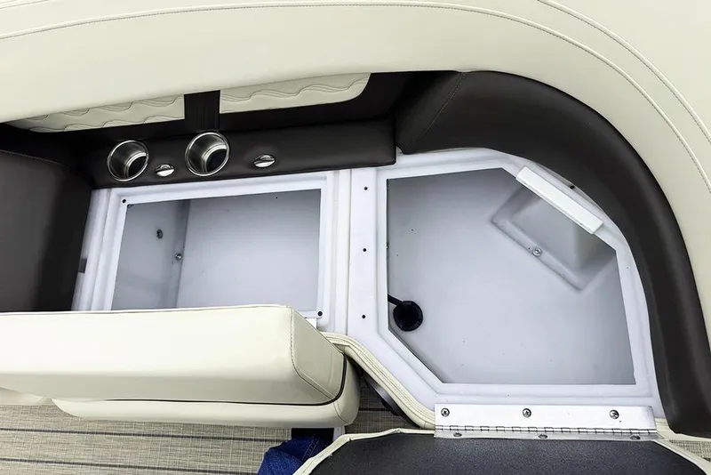 Slide: The Image of Interior storage compartment of 2026 SunCatcher Fusion 324SL boat, featuring sleek design and ventilation. - 16