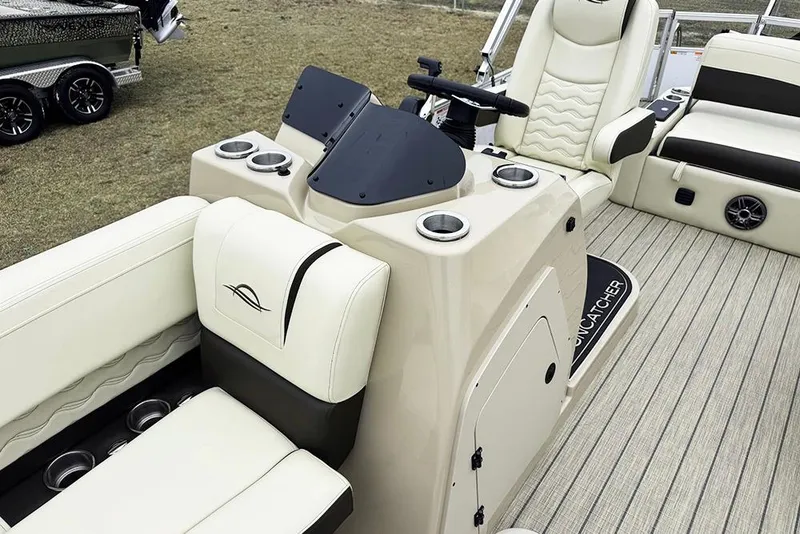 Slide: The Image of Luxurious interior of 2026 SunCatcher Fusion 324SL boat with plush seating and modern console. - 17