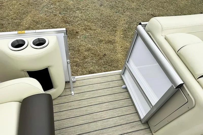 Slide: The Image of 2026 SunCatcher Fusion 324SL boat interior with cup holders and seating on deck. - 25
