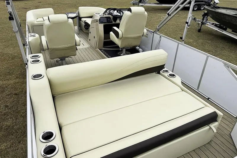 Slide: The Image of Luxurious interior of 2026 SunCatcher Fusion 324SL pontoon boat with plush seating and cup holders. - 40