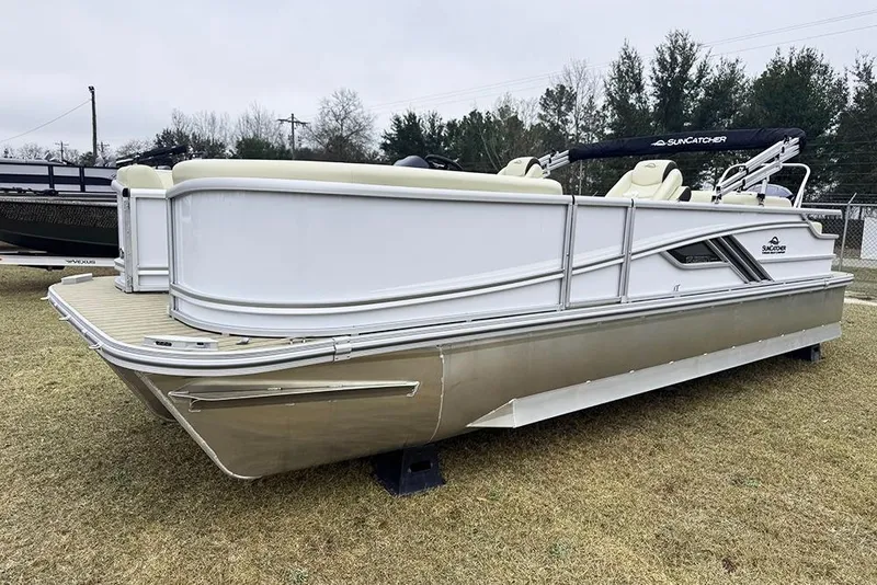 Slide: The Image of 2026 SunCatcher Fusion 324SL pontoon boat on display, featuring sleek design and spacious seating. - 7