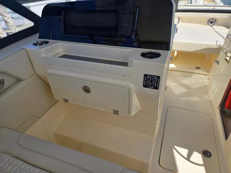 Slide: The Image of The image shows the interior of a 2027 Scout 288 Dorado boat with modern controls. - 11