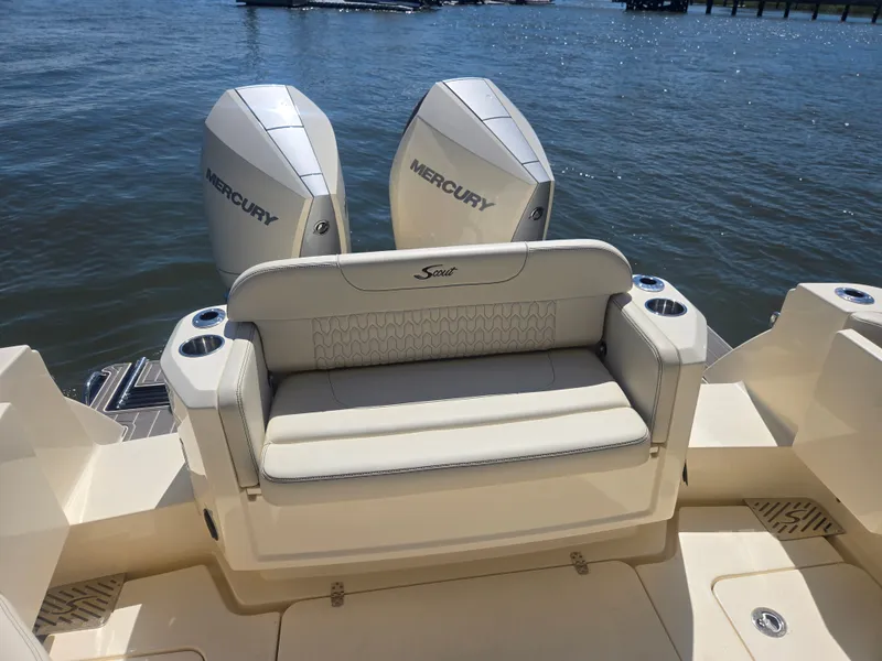 Slide: The Image of The 2027 Scout 288 Dorado features a comfortable rear bench seat with two Mercury outboard engines. - 1