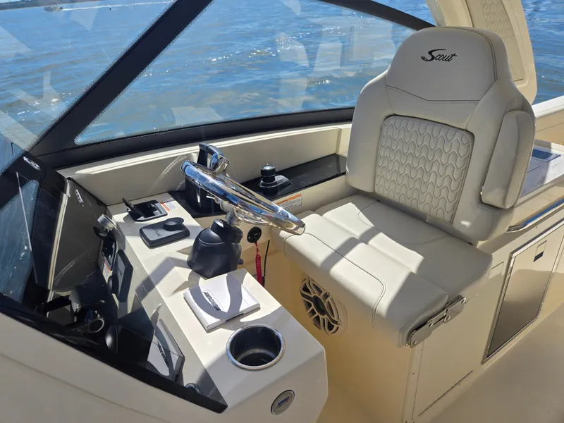 Slide: The Image of The image shows the cockpit of a 2027 Scout 288 Dorado with a beige seat and controls. - 15