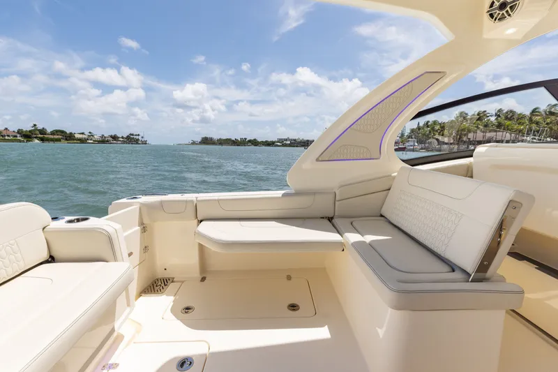 Slide: The Image of The image shows the cockpit of a Scout 288 Dorado boat with beige seating and a view of the water. - 5