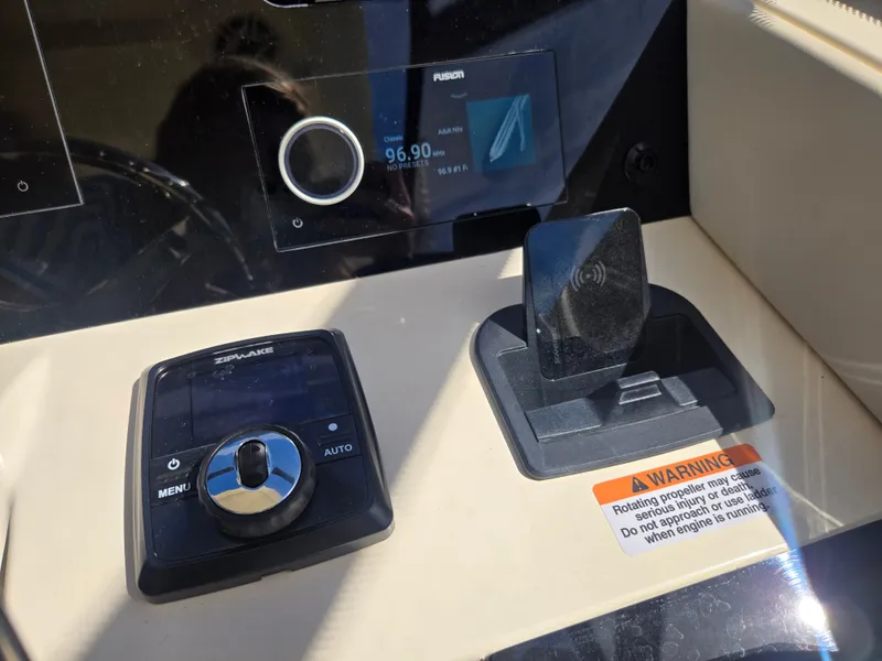 Slide: The Image of The image shows the dashboard of a Scout 288 Dorado with modern controls and a warning label. - 17
