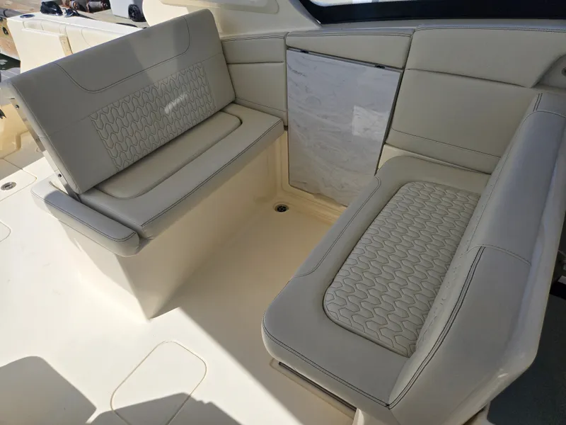 Slide: The Image of The 2027 Scout 288 Dorado features elegant cream-colored seating with textured upholstery. - 7