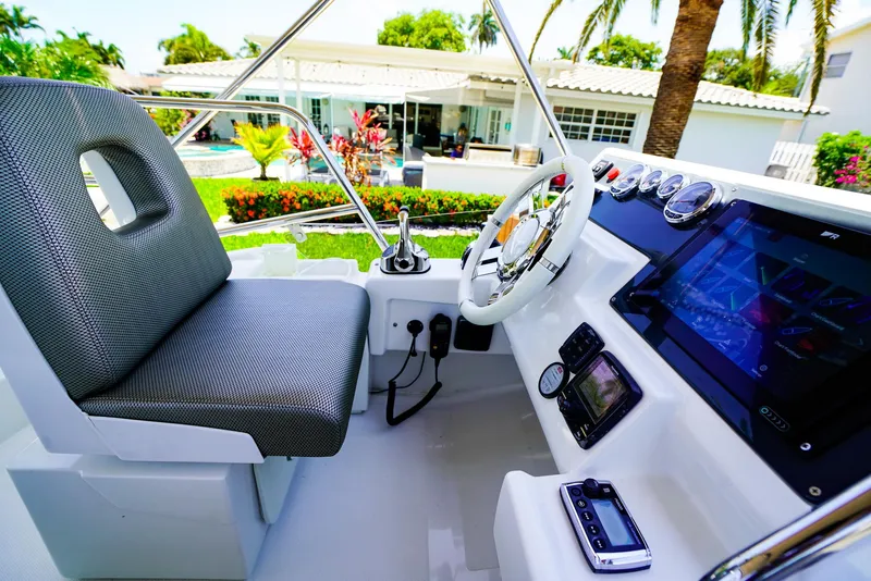 Slide: The Image of Cockpit of 2017 Azimut 42 Fly yacht with modern controls and seating. - 19