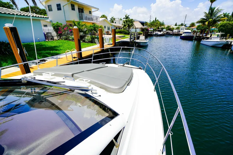 Slide: The Image of Azimut 42 Fly 2017 yacht docked in a sunny canal with waterfront homes. - 24