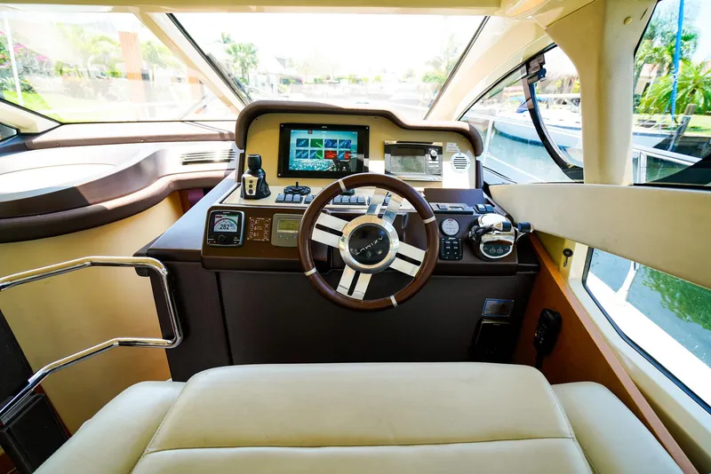 Slide: The Image of Helm of 2017 Azimut 42 Fly yacht with modern navigation controls. - 36