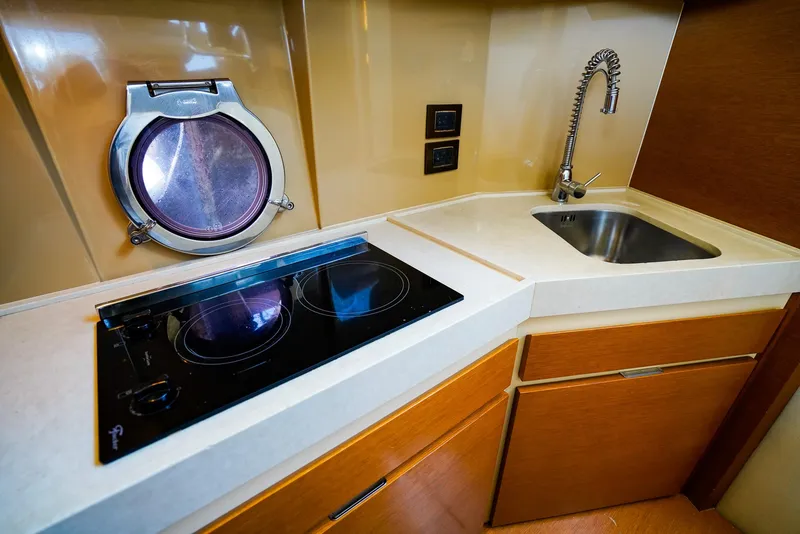 Slide: The Image of Modern kitchen in 2017 Azimut 42 Fly yacht with stove, sink, and porthole. - 38