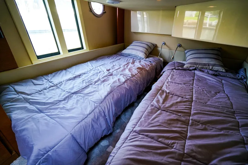 Slide: The Image of Twin beds in the cozy cabin of a 2017 Azimut 42 Fly yacht. - 39