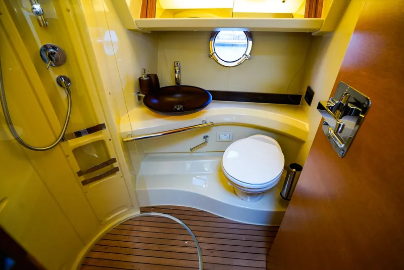 Slide: The Image of Luxurious bathroom in 2017 Azimut 42 Fly yacht with modern fixtures and wooden flooring. - 41
