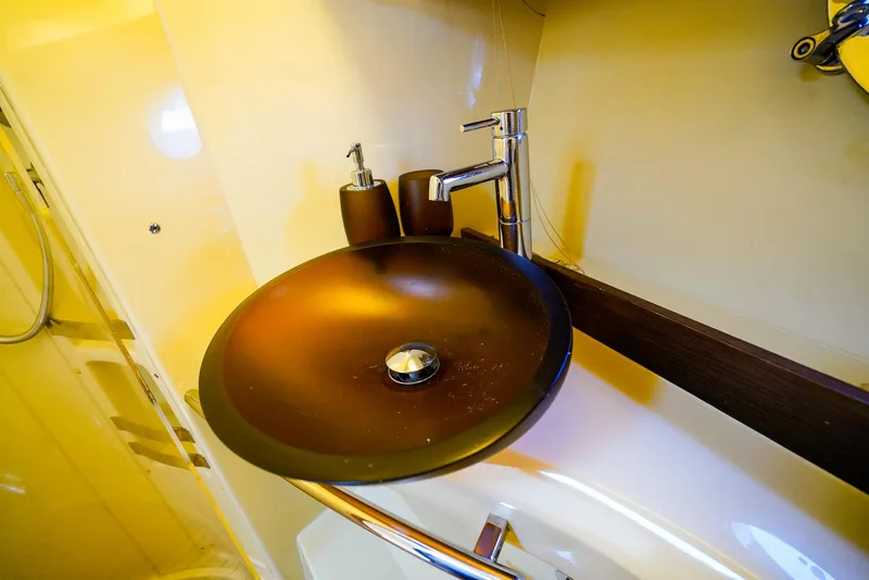 Slide: The Image of Luxurious bathroom sink on 2017 Azimut 42 Fly yacht, featuring modern design and fixtures. - 42