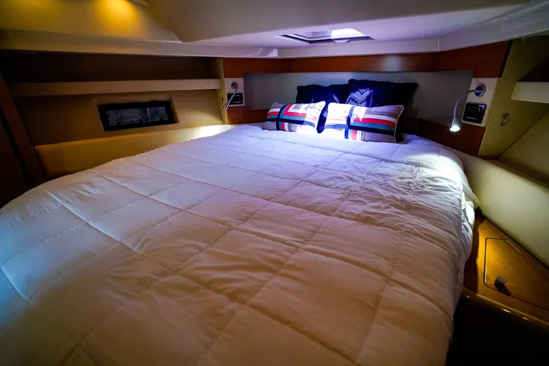Slide: The Image of Luxurious bedroom interior of 2017 Azimut 42 Fly yacht with cozy bedding. - 43