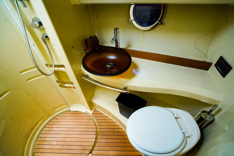 Slide: The Image of Luxurious bathroom in 2017 Azimut 42 Fly yacht with modern fixtures and wooden flooring. - 47