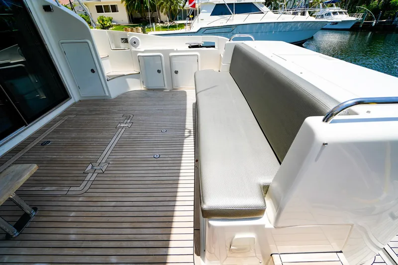Slide: The Image of Azimut 42 Fly 2017 yacht deck with seating and wooden flooring. - 8