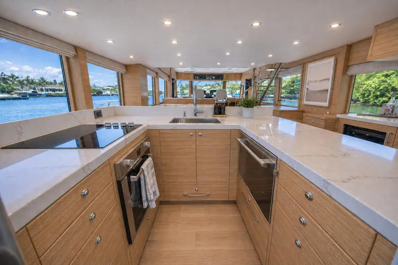 Slide: The Image of Luxurious kitchen interior of 2026 Offshore Yachts CE Series, featuring modern appliances and elegant design. - 1