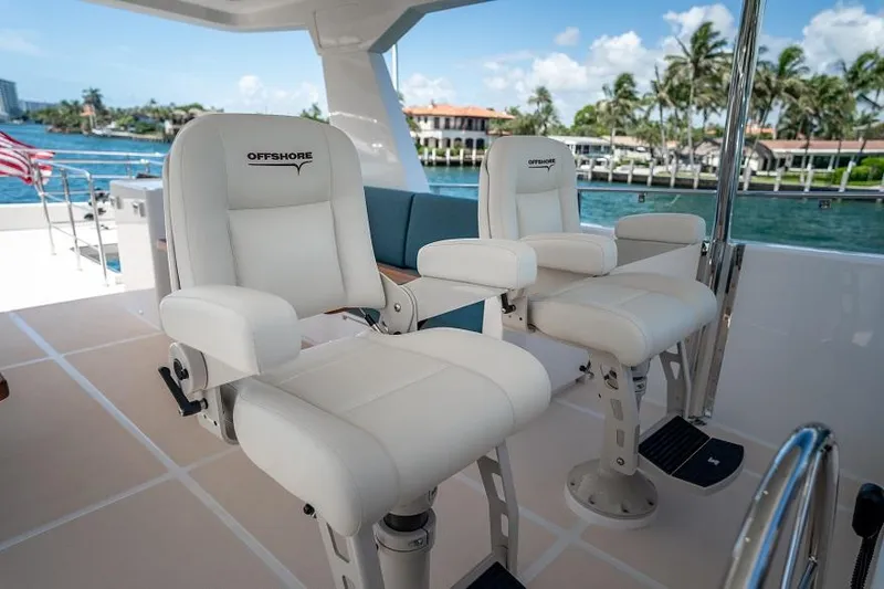 Slide: The Image of Luxury seating on 2026 Offshore Yachts CE Series, with waterfront view. - 17