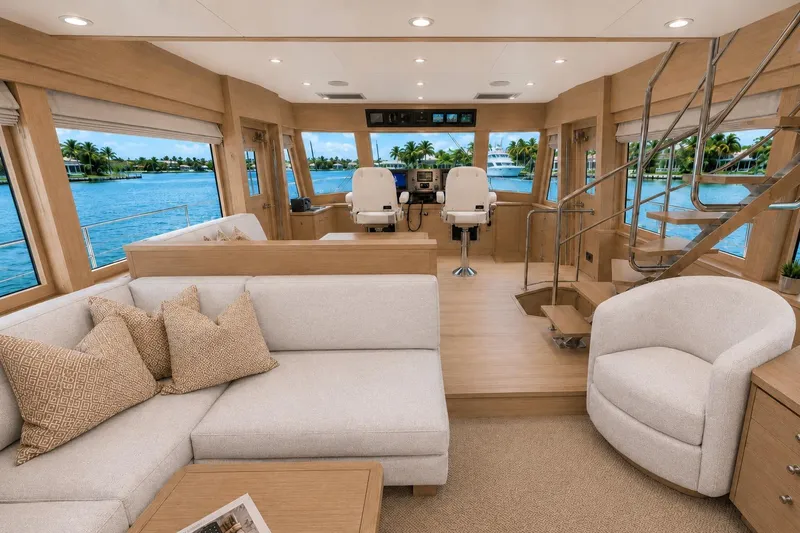 Slide: The Image of Luxurious interior of 2026 Offshore Yachts CE Series, featuring elegant seating and panoramic windows. - 2
